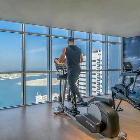 Pullman Sharjah Hotel Exterior photo A man using a cross trainer