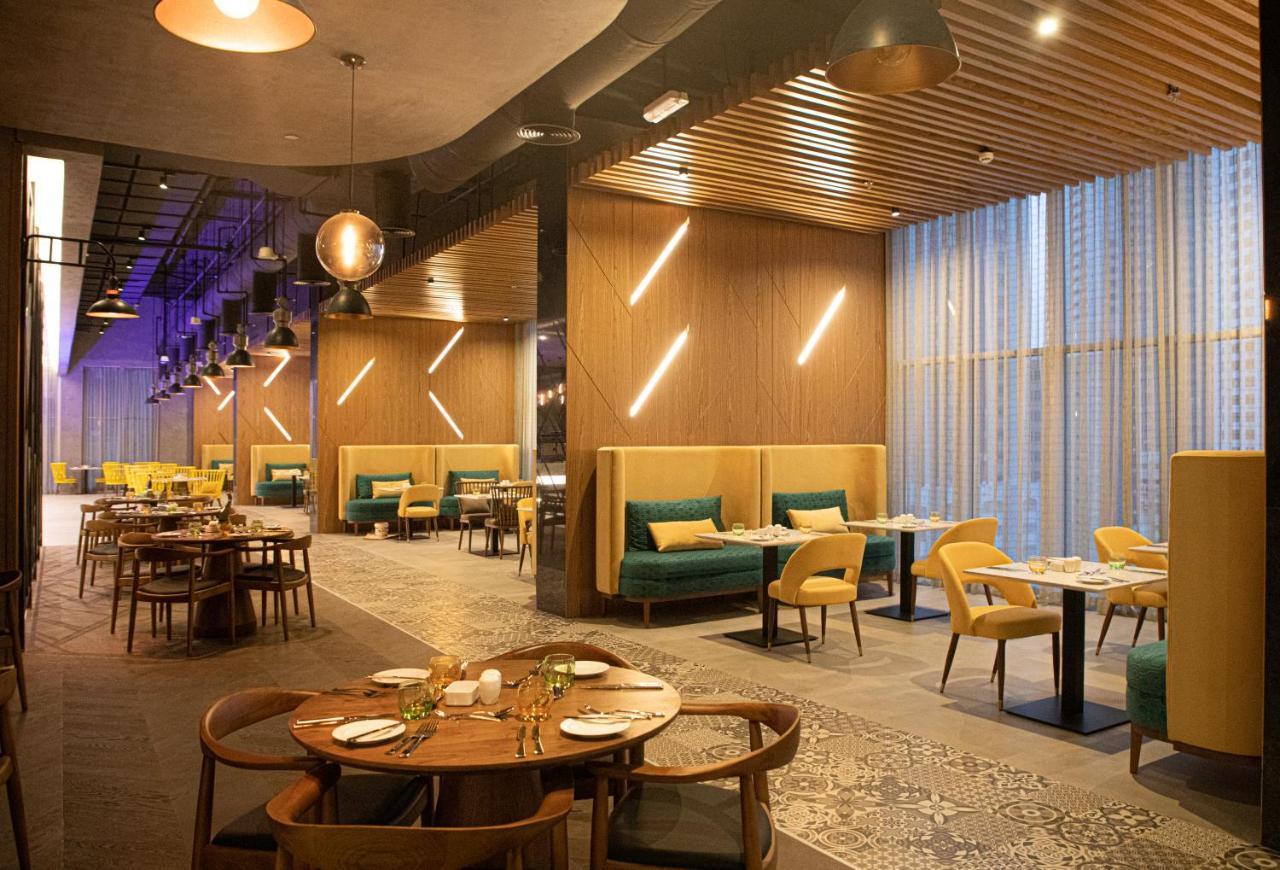 Pullman Sharjah Hotel Exterior photo The interior of the restaurant